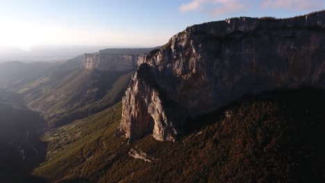Aerial-drone-shot-flying-towards-a-mountain-in-vercors-massif-France.-Sunset